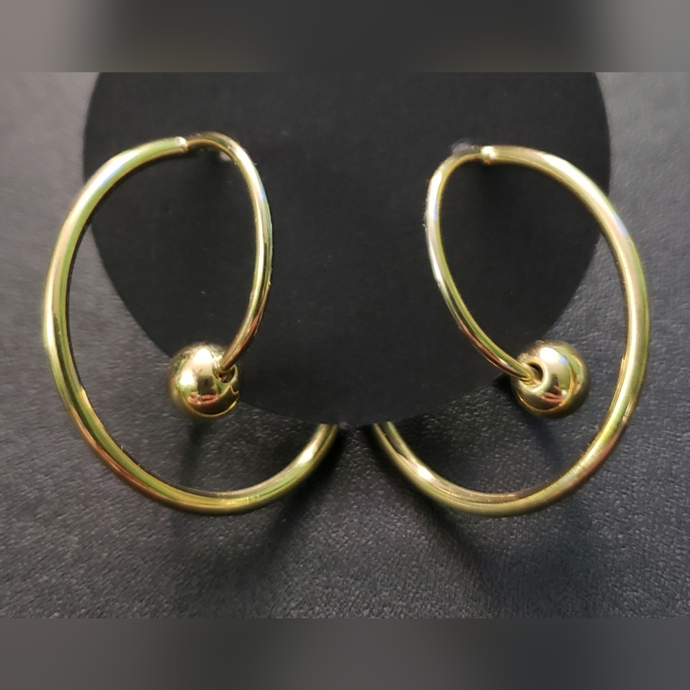 Gold tone hoop and ball earrings